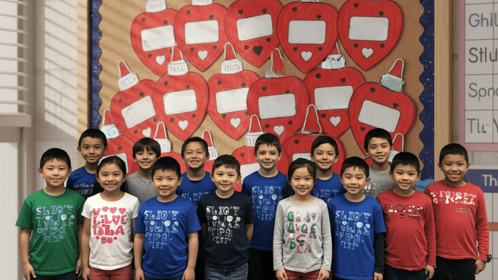 we stick together classroom bulletin board with glue bottle hearts and student names