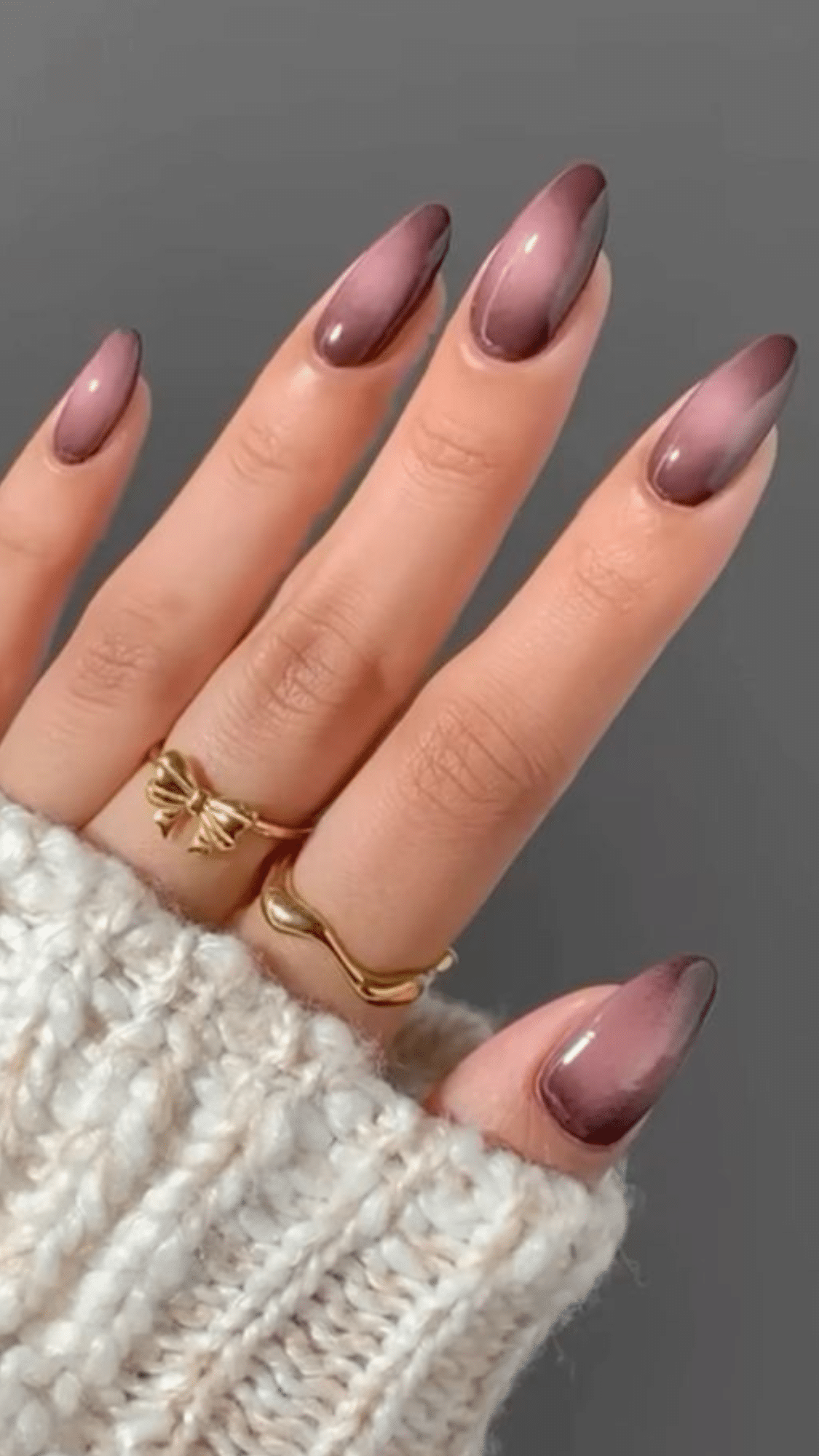 Almond-shaped nails with a smooth gradient from mauve to deep brown, creating a chic classy brown nail designs look.