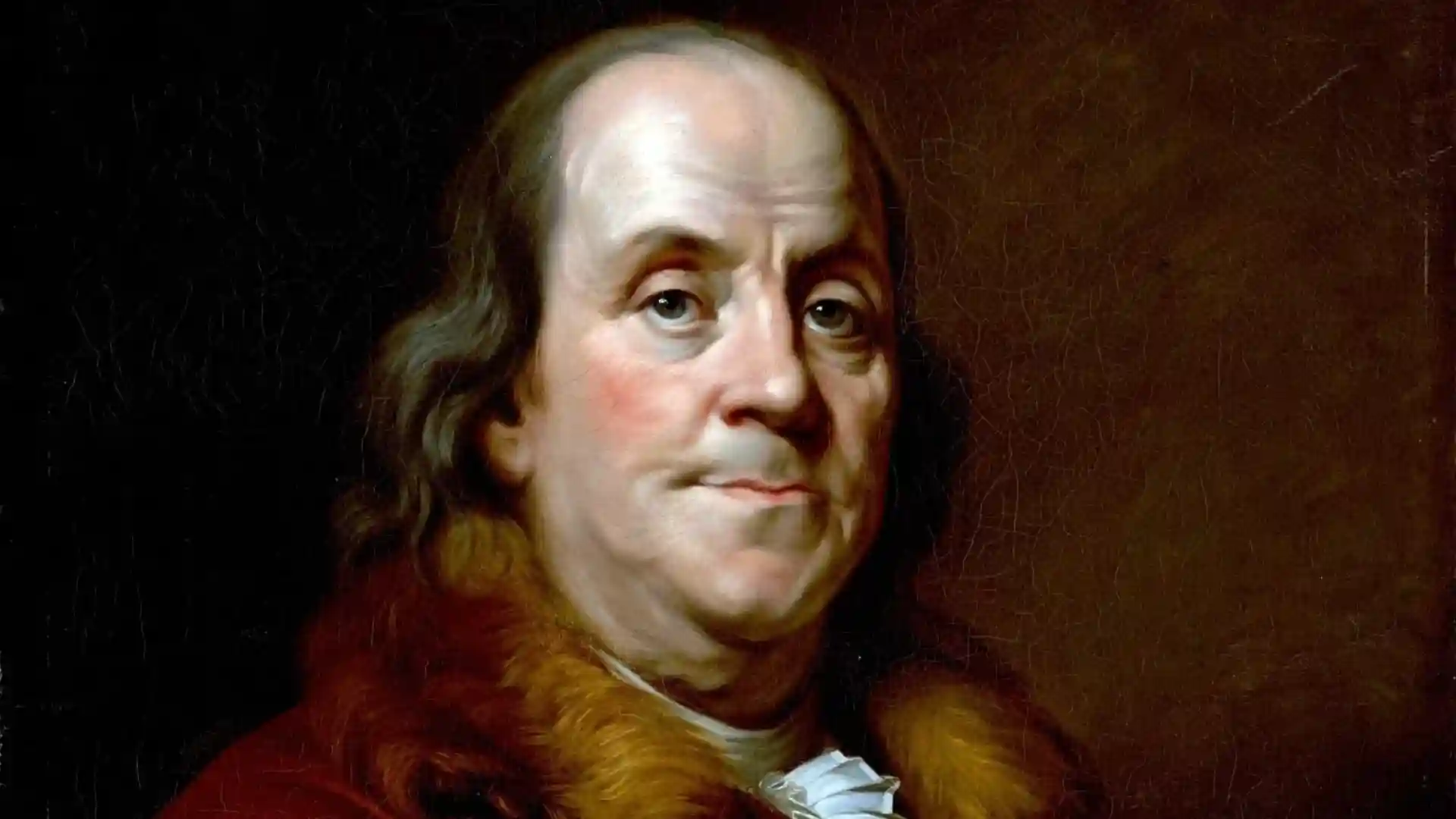 A formal oil portrait of Benjamin Franklin wearing a red coat with a fur collar and a white ruffled cravat.