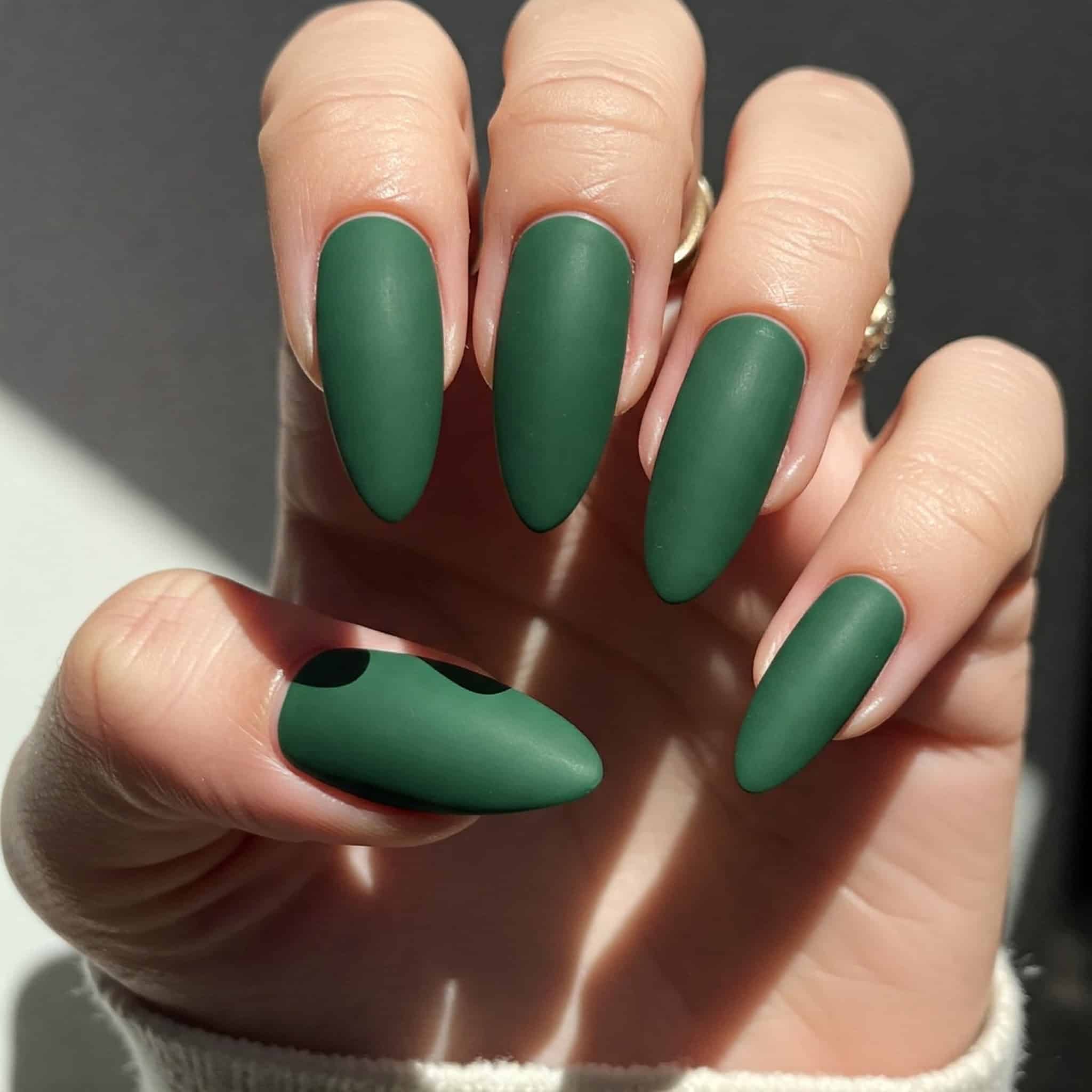 Trendy green matte nails accented offering a unique and fashionable nail art style
