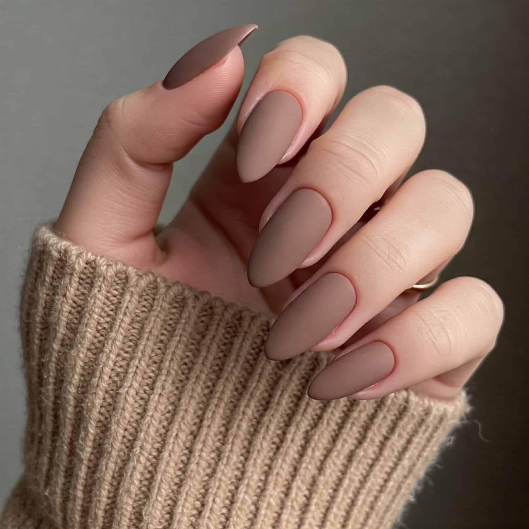 Matte mocha nails for autumn nails with brown nails on fair skin tone.