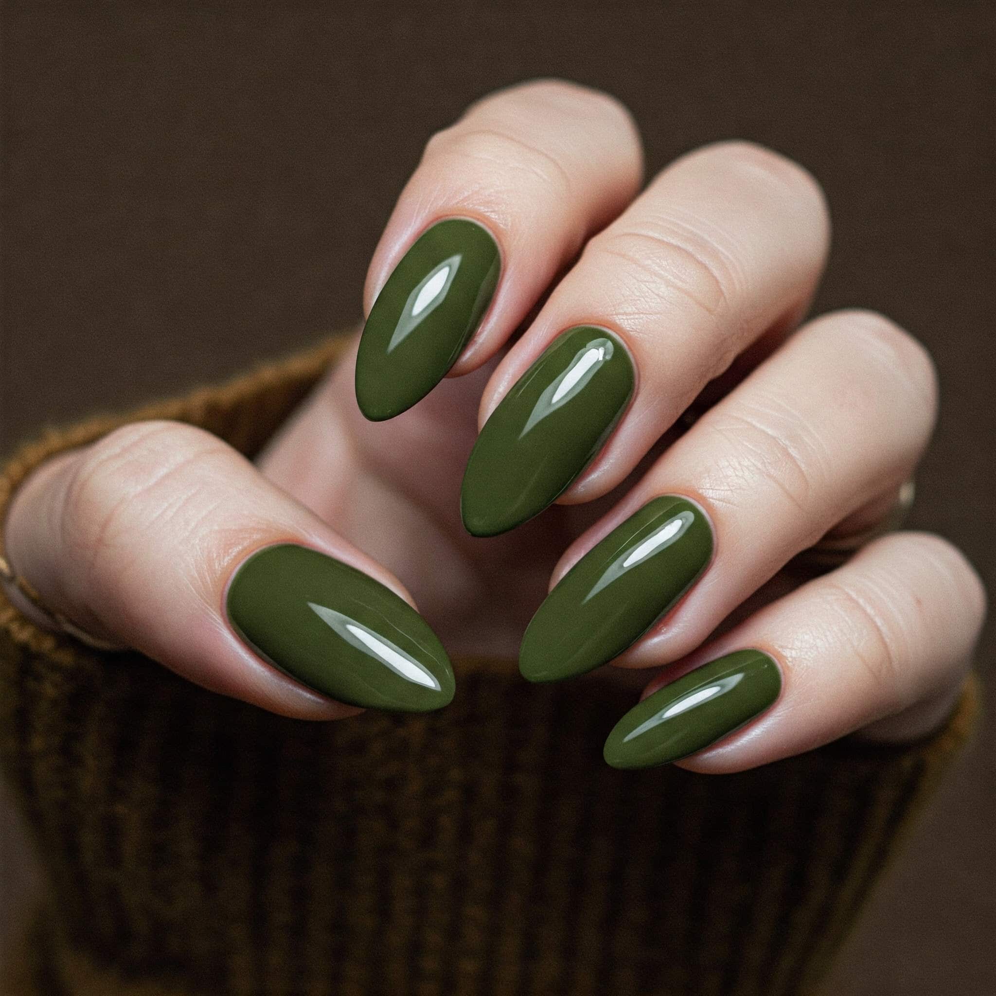Olive green nails on medium length nails on fair skin tone.