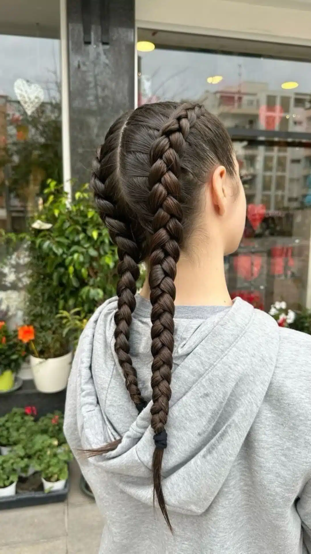 Two Dutch braids styled neatly down the back
