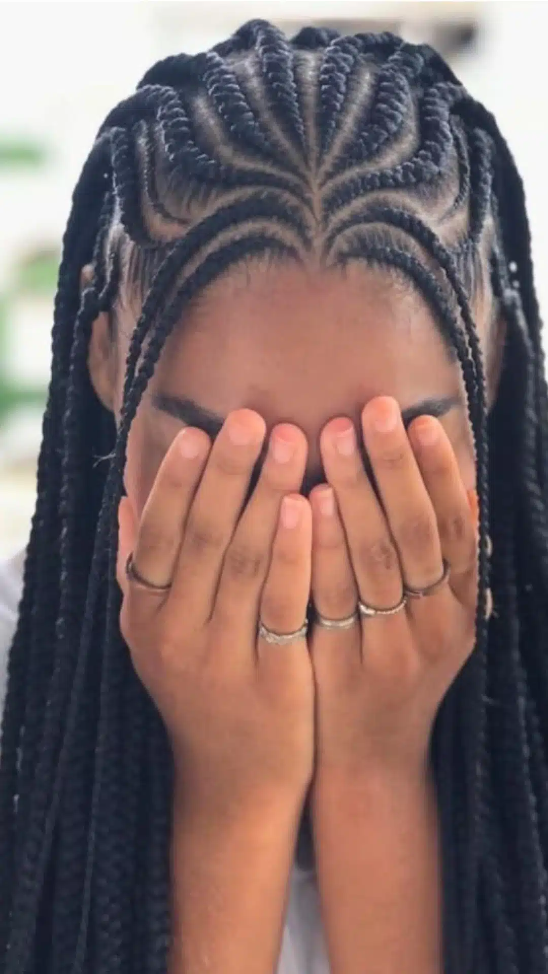 Fulani braids with cornrow patterns framing the front hairline