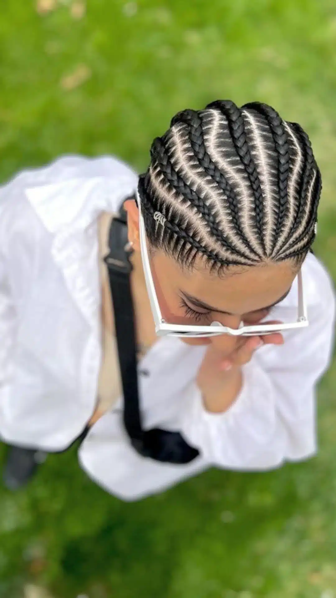 Ghana braids styled in a sleek feed in pattern close to the scalp