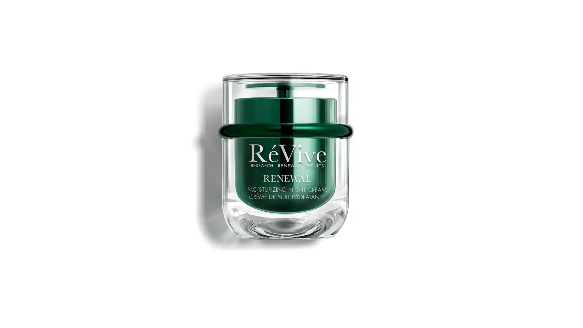 RéVive Renewal Moisturizing Night Cream in a green glass jar with a clear outer case on a white background.