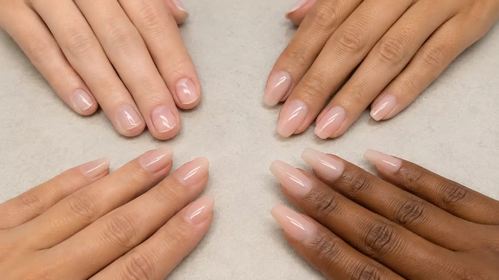 A close-up of intricately designed nail art featuring various colors and patterns on manicured nails.