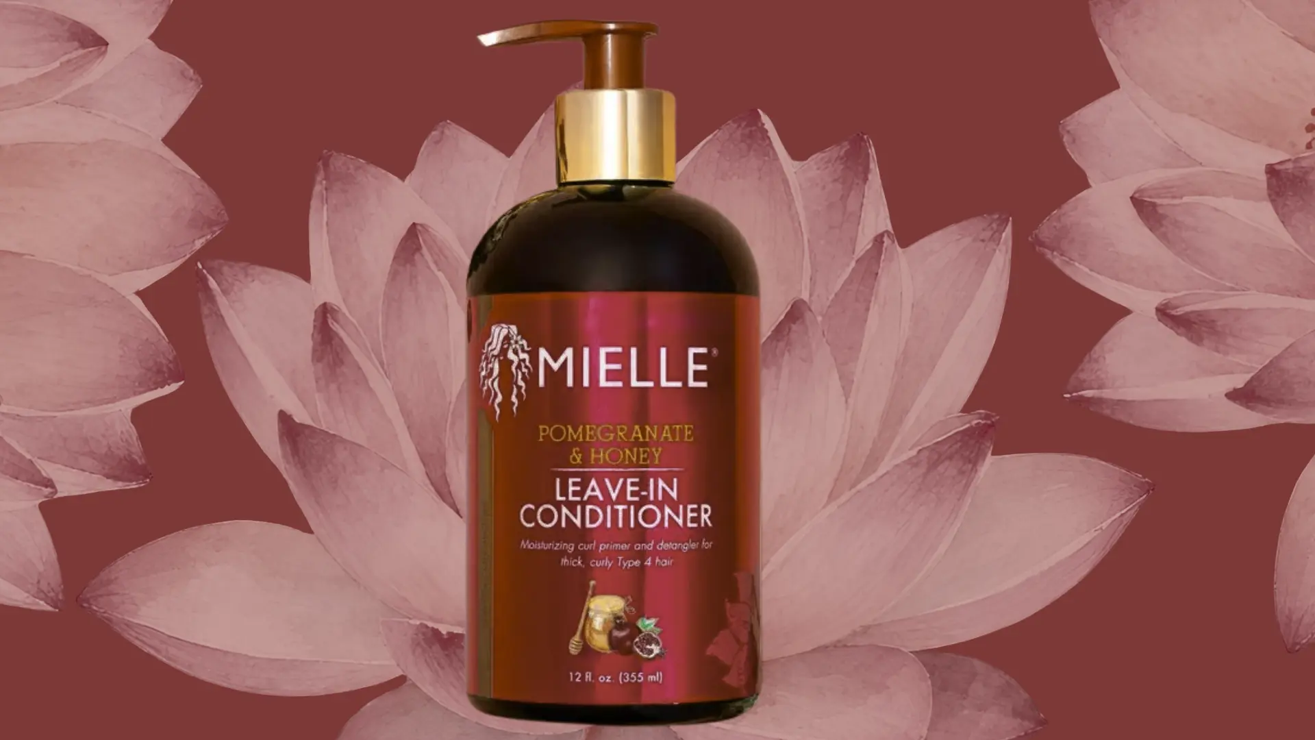 mielle leave in conditioner bottle for curly hair on a floral background