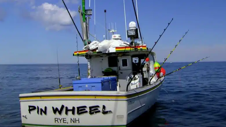 PinWheel commercial fishing boat floating on calm ocean waters
