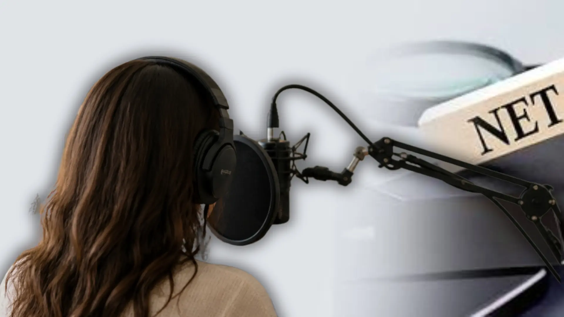 Voice actor recording audio in a home studio with headphones and a professional microphone